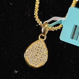 .21CTW VVSD Moissanite Gold over Pendant on a 20" Twisted Rock Chain.